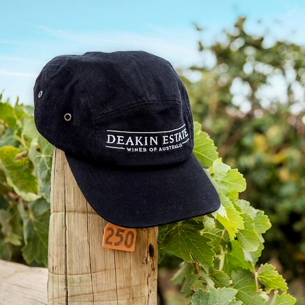 Deakin Estate Baseball Cap on Vineyard Post