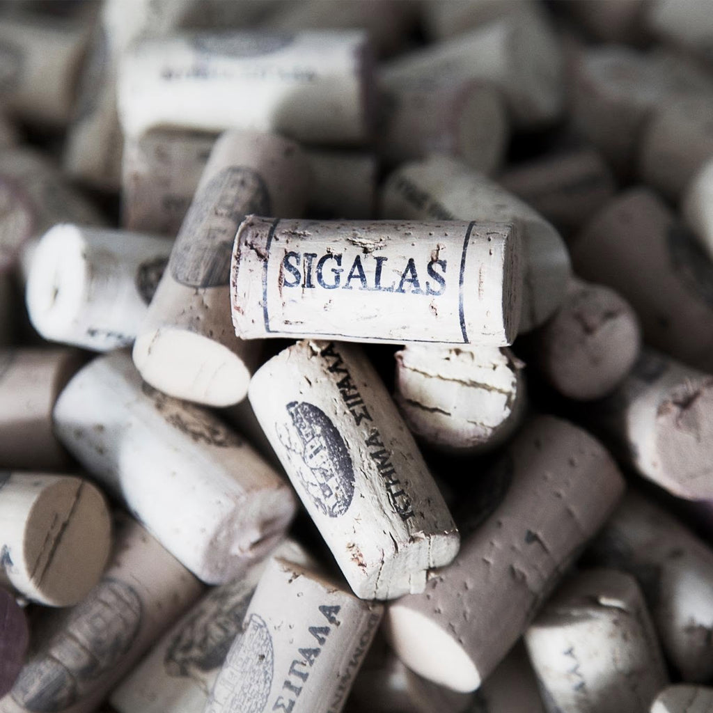 A collection of corks with the word Sigalas stamped on the side