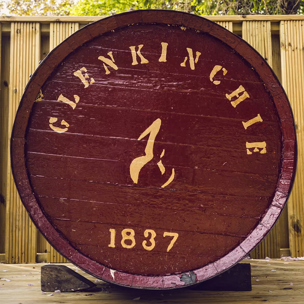 Glenkinchie Malt Whisky Barrel Top Painted in deep red and stamped in yellowy gold is the word Glenkinchie and the date 1837