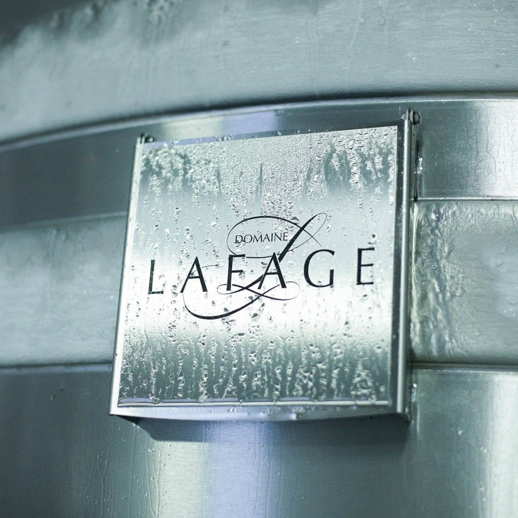 Close up image of Domaine Lafage nameplate affixed to outside of a wine barrel
