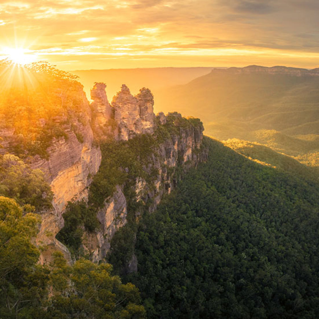 The iconic Three Sisters rock formation in the Blue Mountains, New South Wales, showcasing the state's dramatic natural landscape