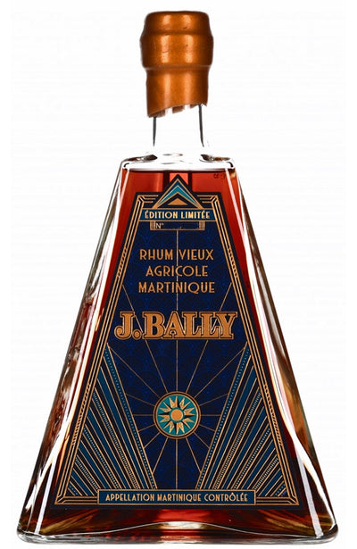 Bottle of J. Bally rhum in Art Deco Triangle Shaped bottle with a decorative label on a white background