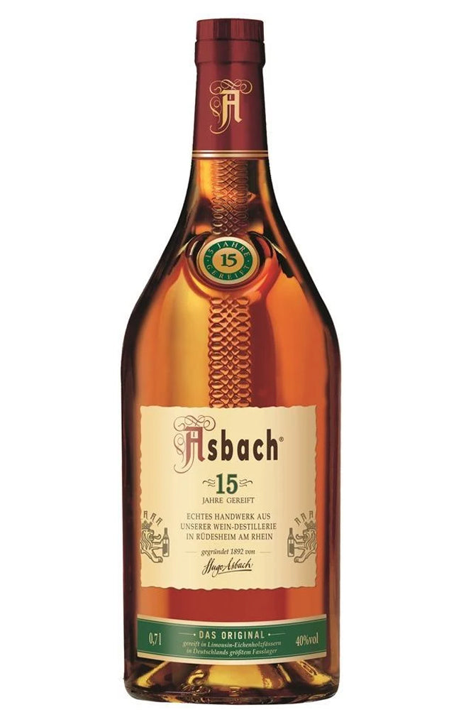 A bottle of Asbach 15 Year Old Brandy in a glass bottle, featuring a cream-colored central label, a green and gold seal, and a dark red foil cap, set against a plain white background.