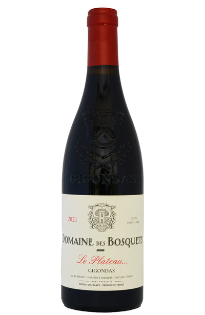 A bottle of Domaine des Bosquets Le Plateau Gigondas red wine, featuring a dark glass bottle with a red foil top and a cream-colored label with black and red text.