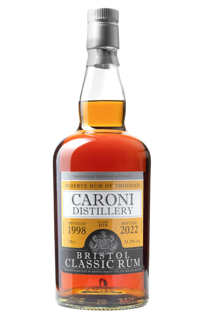 A bottle of Caroni Distillery Bristol Classic Rum, 70cl, showing the amber liquid inside a clear glass bottle with a black and gold label and a silver cap, set against a plain white background.