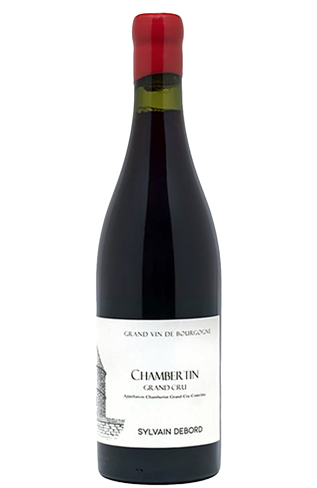 A bottle of Chambertin Grand Cru red wine by Sylvain Debord, featuring a dark glass bottle with a white label and a red foil cap, isolated on a white background.