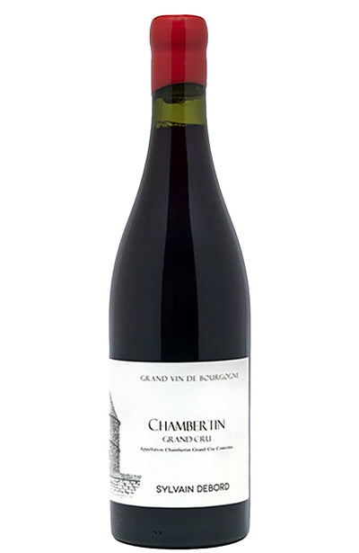A bottle of Chambertin Grand Cru red wine by Sylvain Debord, featuring a dark glass bottle with a white label and a red foil cap, isolated on a white background.