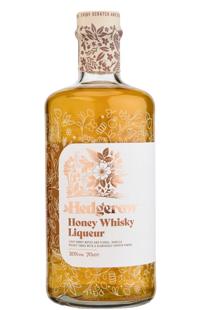 A bottle of Hedgerow Honey Whisky Liqueur with a white label and floral illustrations, filled with golden amber liquid, on a white background.