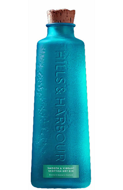 Blue bottle of Hills & Harbour Scottish Dry Gin with a cork cap on a white background