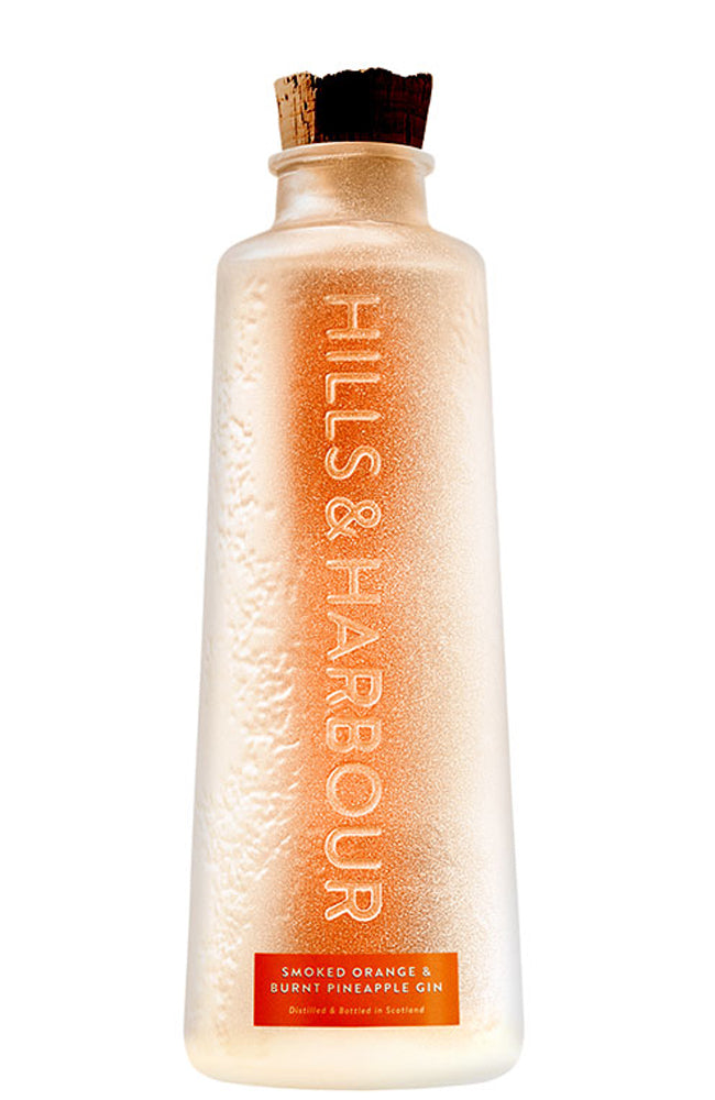 A frosted glass bottle of Hills & Harbour Smoked Orange & Burnt Pineapple Gin, featuring a cork stopper and an orange label at the bottom, set against a plain white background.