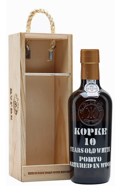 Kopke 10 Years Old White Port wine bottle with wooden box on a white background