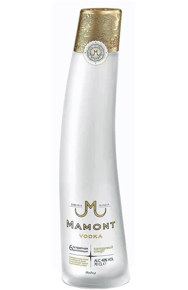 A tall, slender bottle of Mamont Vodka on a plain white background. The bottle is frosted white with a textured metallic gold cap and gold lettering for the brand name 'Mamont'.