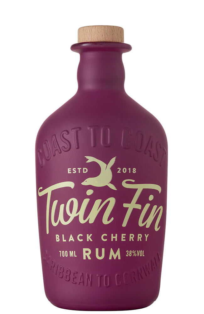 Purple bottle of Twin Fin Black Cherry Rum with a cork cap on a white background